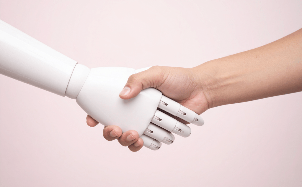 ai and human shaking hands